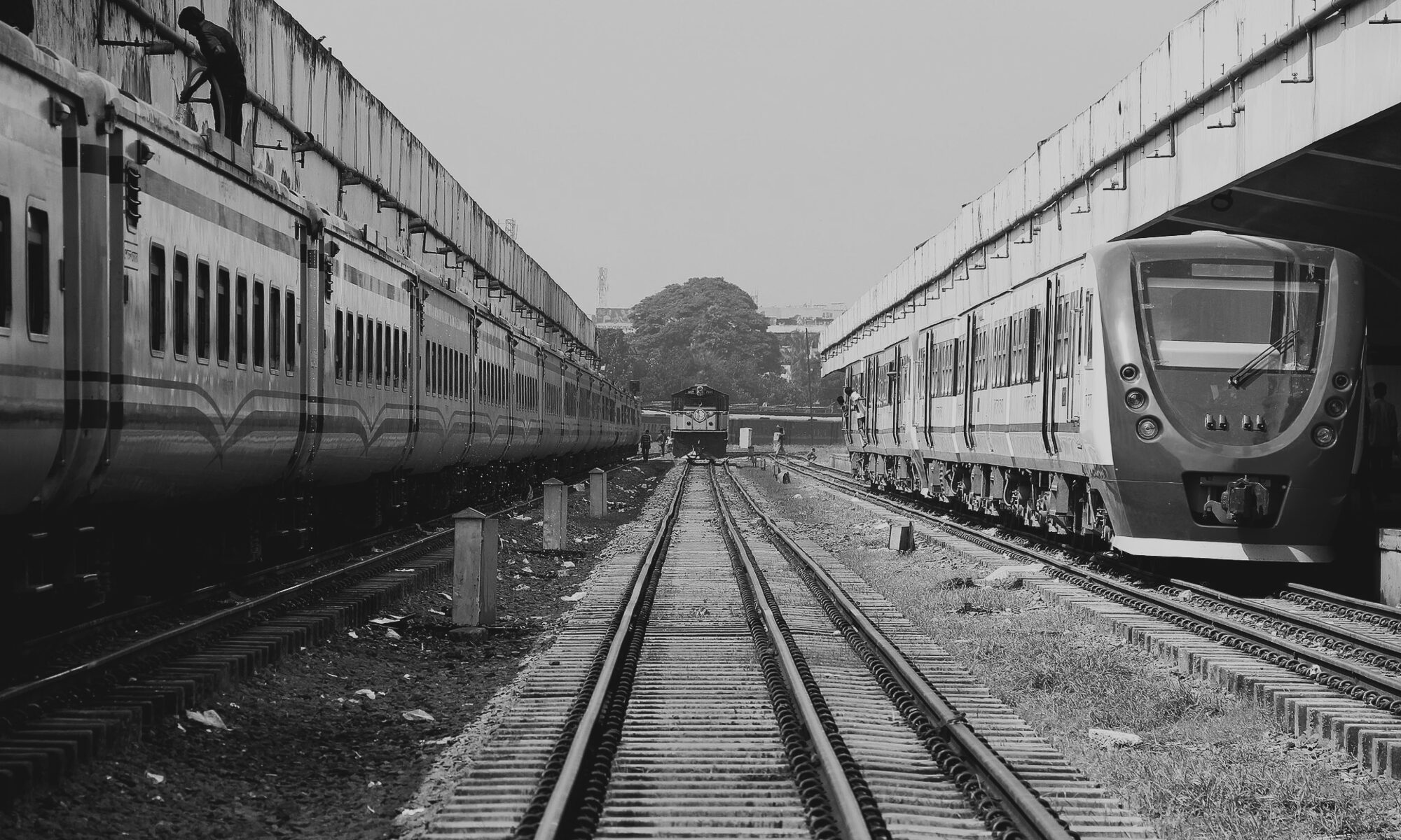 Bangladesh Railway coaches and converging track lines in a railway yard